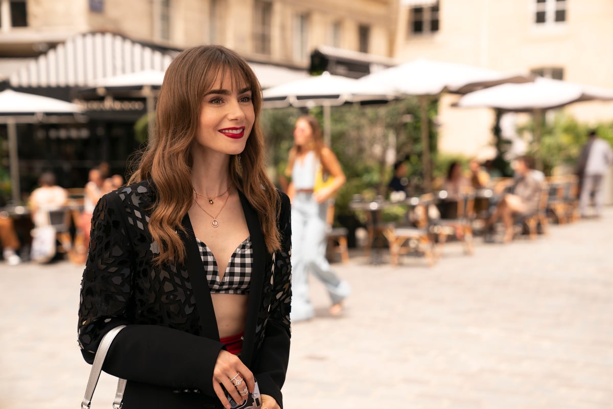 Flip open the profile of the opposite style between Lily Collins and Emily Cooper